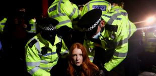 Woman being arrested by the UK police
