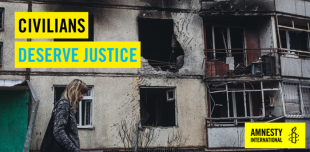 A person walks by a building with evidence of shelling. A banner reads "civilians deserve justice". 