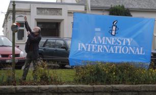 Amnesty banner being raised outside Trinity Parish Hall