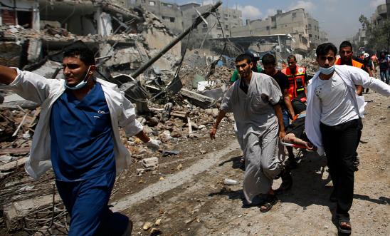 Doctors and medics in Gaza rush an injured man to hospital Doctors and medics in Gaza rush an injured man to hospital