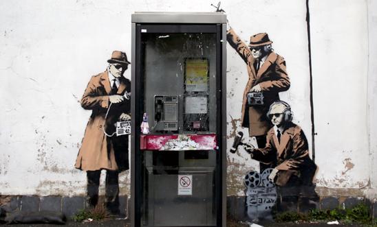 Alleged Banksy street art - spies around a telephone box in Cheltenham Alleged Banksy street art - spies around a telephone box in Cheltenham