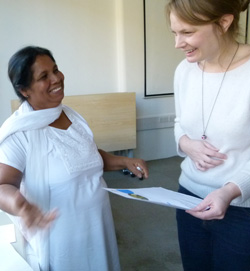 Sandya and Sara looking at messages of solidarity