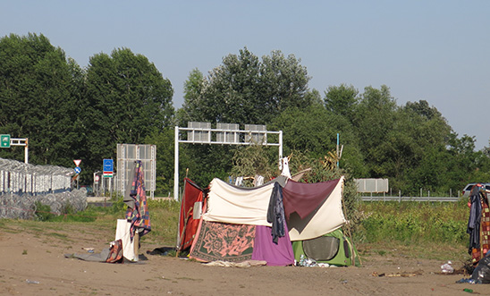 Tents in the refugee camp made of blankets and sticks