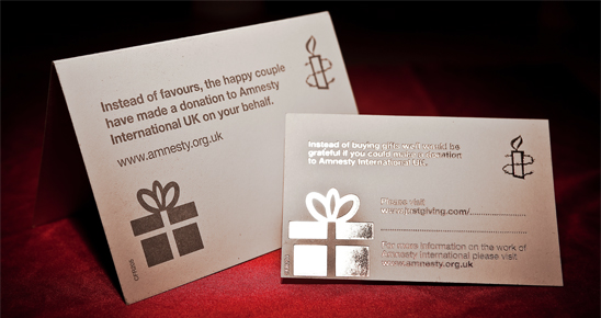 Amnesty-branded wedding card and donation envelope