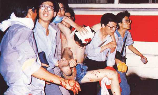 Doctors carry an injured protester to safety on 5 June C. Memo64