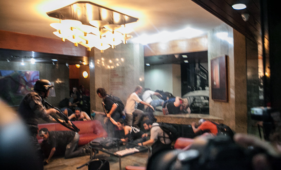 Armed police storm a São Paulo hotel lobby and spray tear gas on 25 January 2014