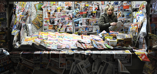 A Russian vendor sells newspapers and magazines in Moscow on 3 March 2010. AFP PHOTO / NATALIA KOLESNIKOVA